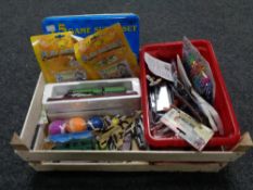 A box of toys to include trains, air craft, binoculars, toy money, games compendium,