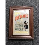 A framed Dewars Finest Scotch Whiskey advertising mirror