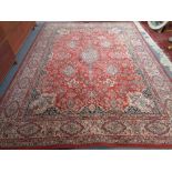 A machined Persian design rug 254 cm x 342 cm.