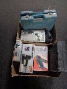 Two boxes of assorted cased and boxed power tools to include Black & Decker sander, heat gun,