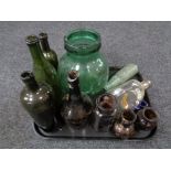 A tray of antique glass bottles and jars,