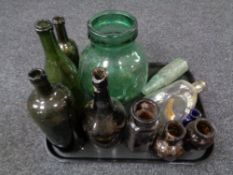 A tray of antique glass bottles and jars,