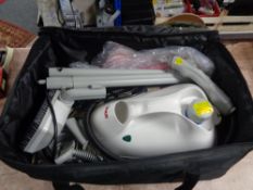 A Polti Vaporetto 950 steam cleaner with accessories in carry bag