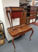 A 19th century mahogany work table together with an antique mahogany serpentine front three drawer