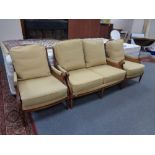 A contemporary three piece bergere suite