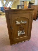 An antique pine wall cabinet bearing Old Shag Tobacco advertising