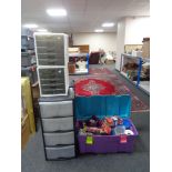 A plastic storage crate with lid containing kitchen ware, alarm system, telephone,