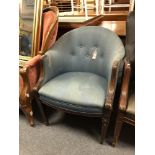 A 20th century mahogany framed elbow chairs upholstered in a blue fabric