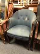 A 20th century mahogany framed elbow chairs upholstered in a blue fabric