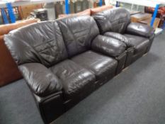 A brown leather two seater settee with matching armchair