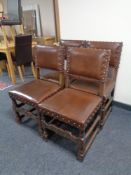 A set of four 20th century oak brown button leather chairs