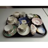 A tray of antique china cups and saucers to include Aynsley moustache cups, Shelley shell dish,