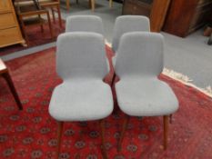 A set of four mid 20th century dining chairs on teak legs