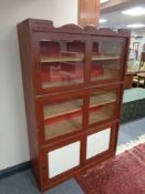 A 20th century stained pine sliding door bookcase