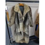 A lady's full length simulated fur coat