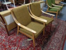 A pair of mid 20th century teak framed armchairs (brown)