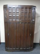 An oak double door wardrobe , height 185 cm, width 125 cm, depth 54 cm.