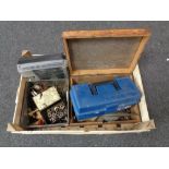 A box containing brass taps, hand tools,