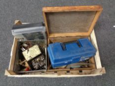 A box containing brass taps, hand tools,