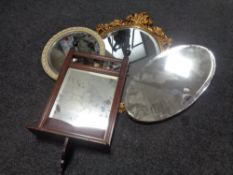 An Edwardian hall mirror with shelf and three further mirrors