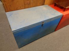 A blue painted pine blanket box