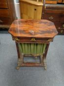 A 19th century mahogany sewing table with ormolu mounts on brass paw feet, height 75 cm,