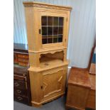 A blond oak leaded glass door corner cabinet