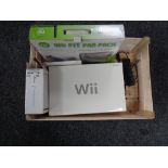 A boxed Nintendo Wii with leads and accessories,