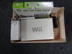 A boxed Nintendo Wii with leads and accessories,