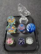 A tray of an Art Deco style glass figure together with seven further glass paperweights