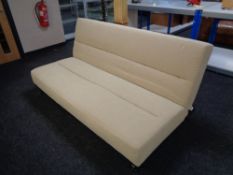 A contemporary folding bed settee