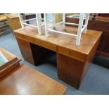 An early 20th century twin pedestal desk fitted three drawers
