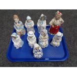 A collection of nine antique bisque and china nodding figures