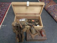 A plywood tool box of hard ware, oil cans, vintage blow lamp,