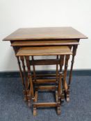 A nest of three mahogany tables on spindle legs