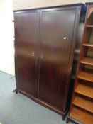 A Stag Minstrel double door wardrobe together with a headboard