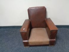 An early 20th century brown vinyl child's armchair