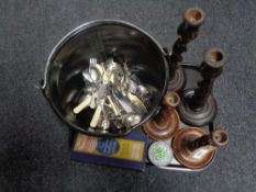 A tray of pair of Edwardian oak barley twist candlesticks, glass paperweight,