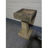 A composite pedestal bird bath