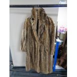 A lady's full length fox fur coat
