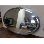 A 1930s oval chrome framed mirror