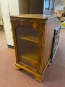 An inlaid yew wood audio cabinet