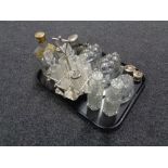 A tray of cruet set on plated stand, three vintage glass jelly moulds, perfume bottle,