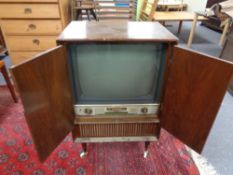 A mid 20th century Linnet and Laursen television in walnut cabinet