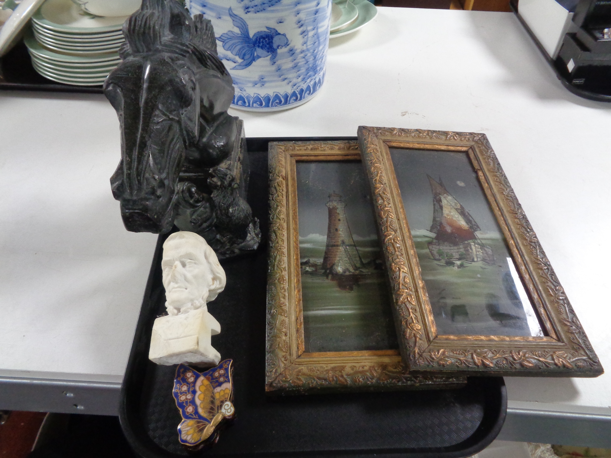 Two Edwardian gilt framed pictures on glass and a carved marble horse head sculpture,