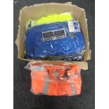 A box of work clothes - florescent jackets