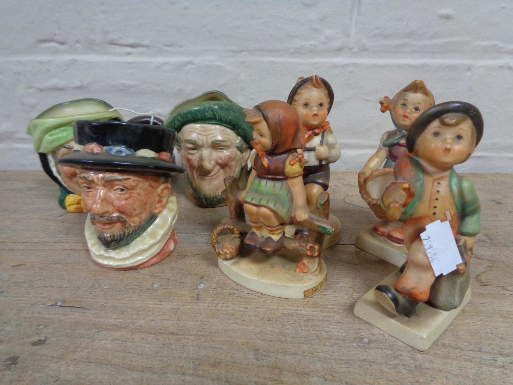 Three small Royal Doulton character jugs; Beefeater, Old Mac and Sairey Gamp,