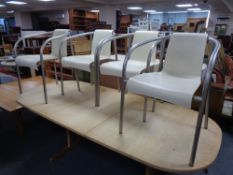 A set of four Danish TripTrap moulded plastic and metal armchairs