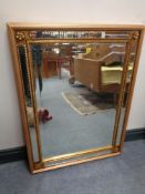 A decorative gilt framed bevelled edge mirror