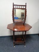 An Edwardian mahogany mirrored fire screen and occasional table